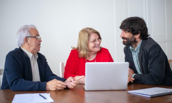 man with beard talking to couple 570x342 - The Process of How to Apply For a Loan 