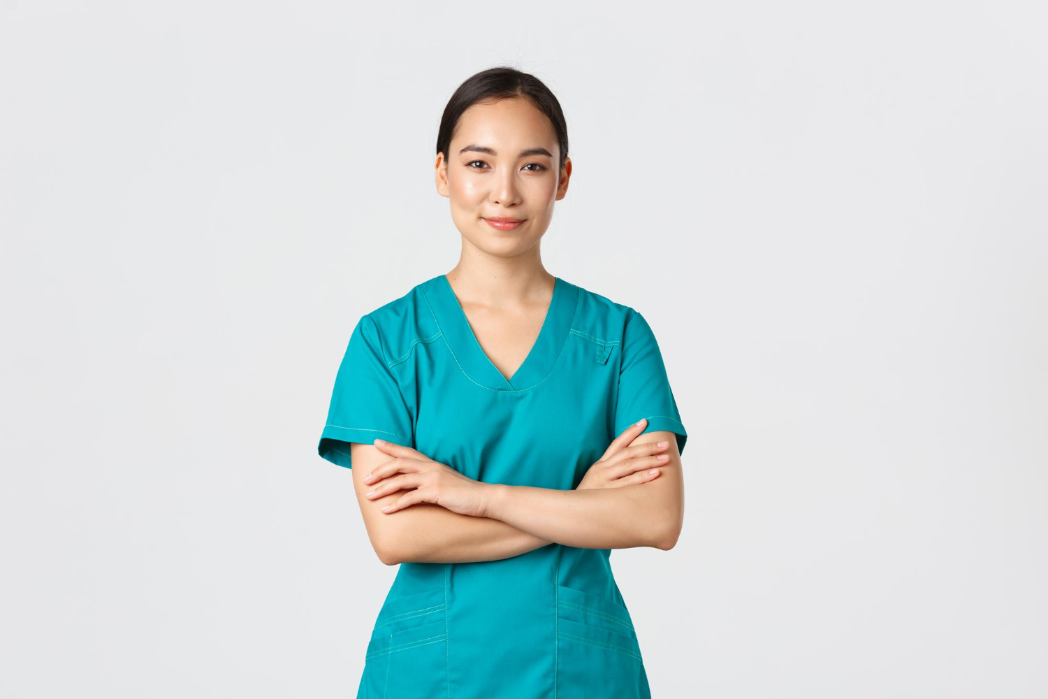 nurse with crossed arms - 8 Things to Consider Before Choosing a Nursing Program