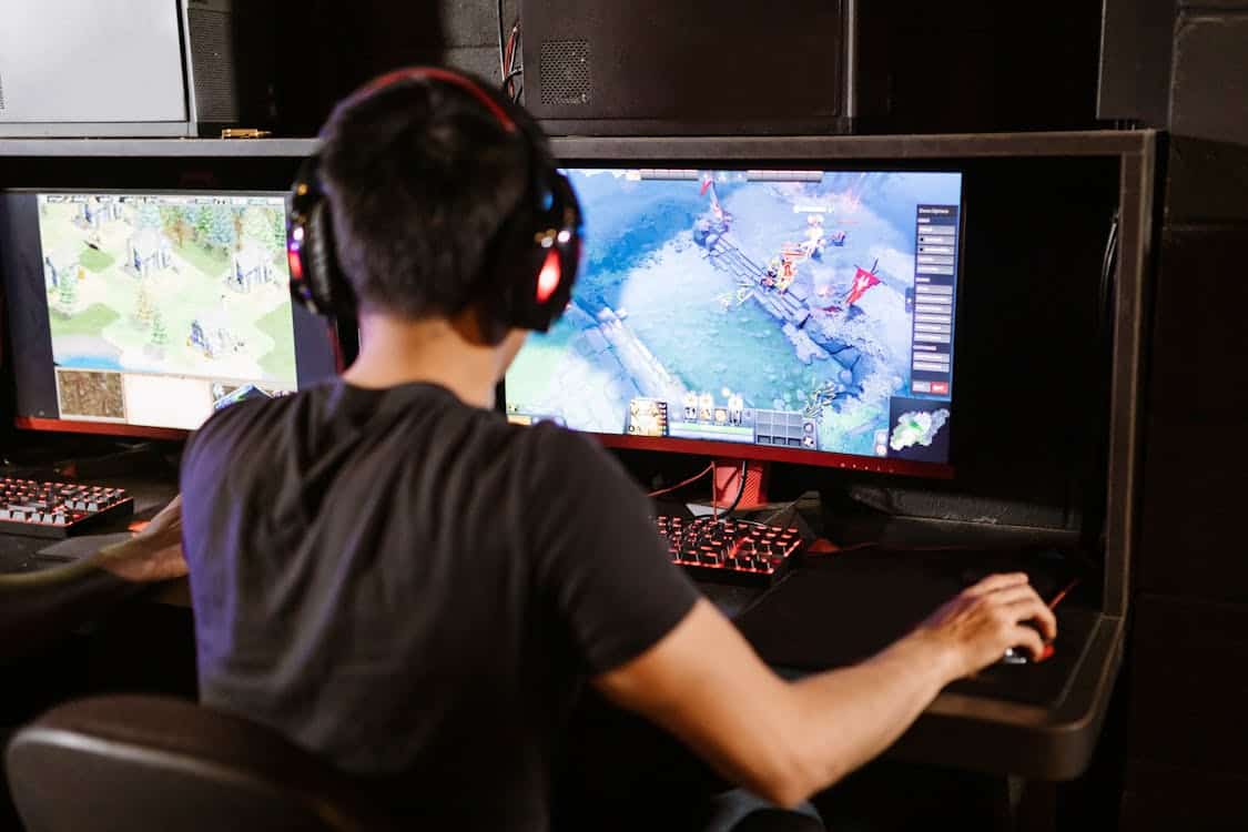 male gamer immersed in PC gaming - Why Sentinels Entering the LCS Is Changing What League of Legends Coaches Say About NA Solo Queue