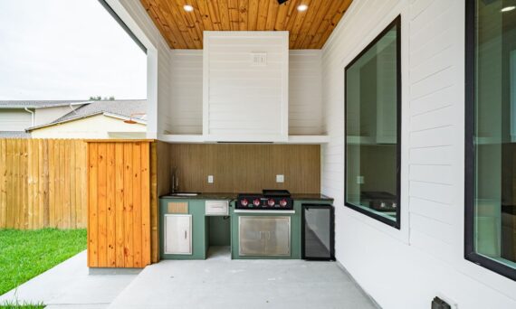 Sleek outdoor kitchen setup with BBQ and fridge 570x342 - The ROI Math Quietly Driving San Diego's Outdoor Kitchen Boom