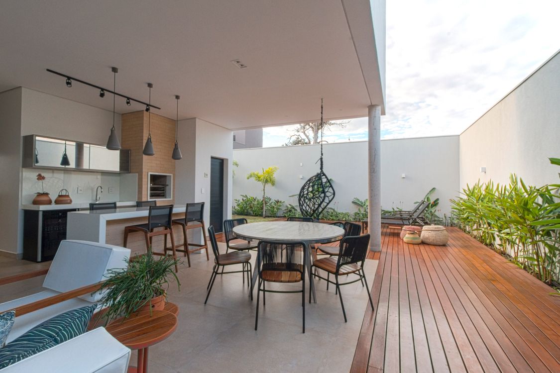 Stylish open patio with dining set kitchen and outdoor decor - The ROI Math Quietly Driving San Diego's Outdoor Kitchen Boom