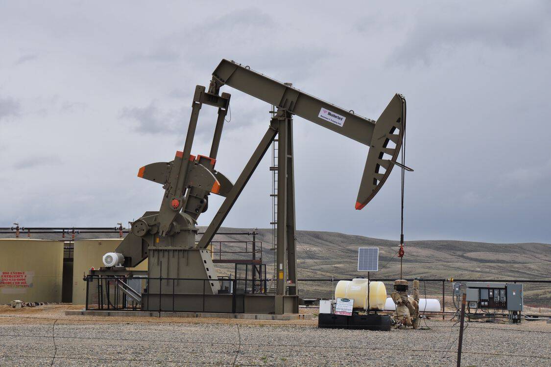 Oil pump jack and equipment at remote industrial site - Closed-Loop Control Is Moving Into Permian Electric Submersible Pump Operations