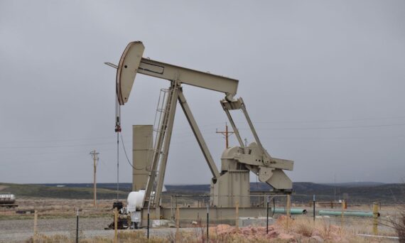 Oil pumpjack surrounded by barren landscape 570x342 - Closed-Loop Control Is Moving Into Permian Electric Submersible Pump Operations